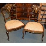 A pair of Edwardian inlaid mahogany bedroom chairs, a pair of inlaid occasional tables, and an oak