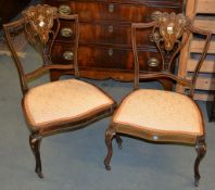 A pair of Edwardian inlaid mahogany bedroom chairs, a pair of inlaid occasional tables, and an oak
