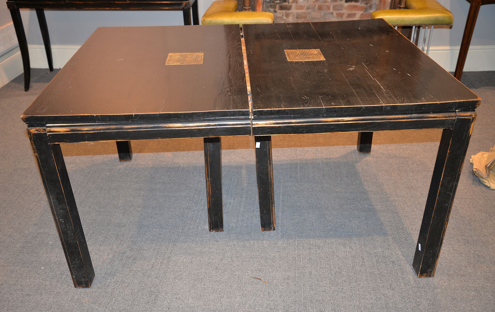 A Chinese ebonised dining table, with four additional leaves, 78cm high, 156cm long unextended,