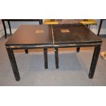 A Chinese ebonised dining table, with four additional leaves, 78cm high, 156cm long unextended,