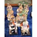 A Staffordshire pottery group of musicians, a pair of figures of the Cobbler and His Wife, and other