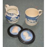 A Staffordshire felspatic stoneware jug; a porter mug; and two blue jasper oval plaques