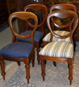A set of four Victorian balloon back dining chairs, each with a drop-in seat