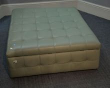 A modern sage green faux leather button upholstered centre ottoman, 40cm high , 120cm x 103cm