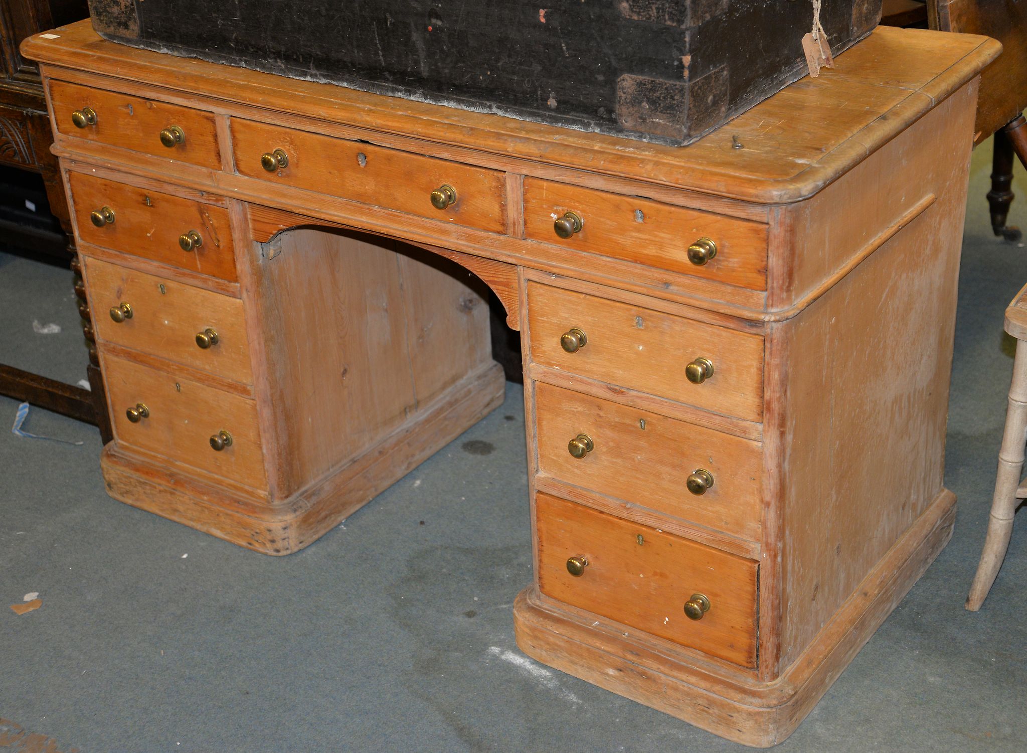A Victorian pine twin pedestal desk, 76cm high, 124cm wide, 60cm deep Provenance: Removed from an
