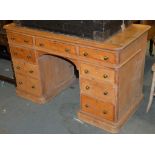 A Victorian pine twin pedestal desk, 76cm high, 124cm wide, 60cm deep Provenance: Removed from an