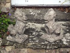 A pair of composition stone models of gryphons, approx 42cm high