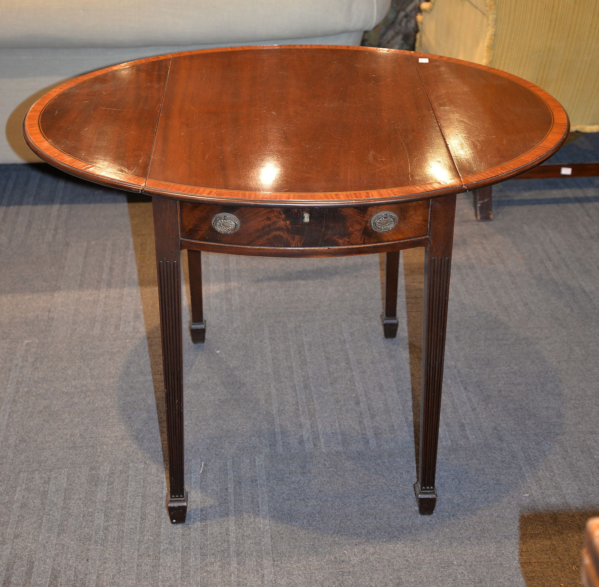 A mahogany and satinwood banded Pembroke table, with single drawer to one end and opposing false