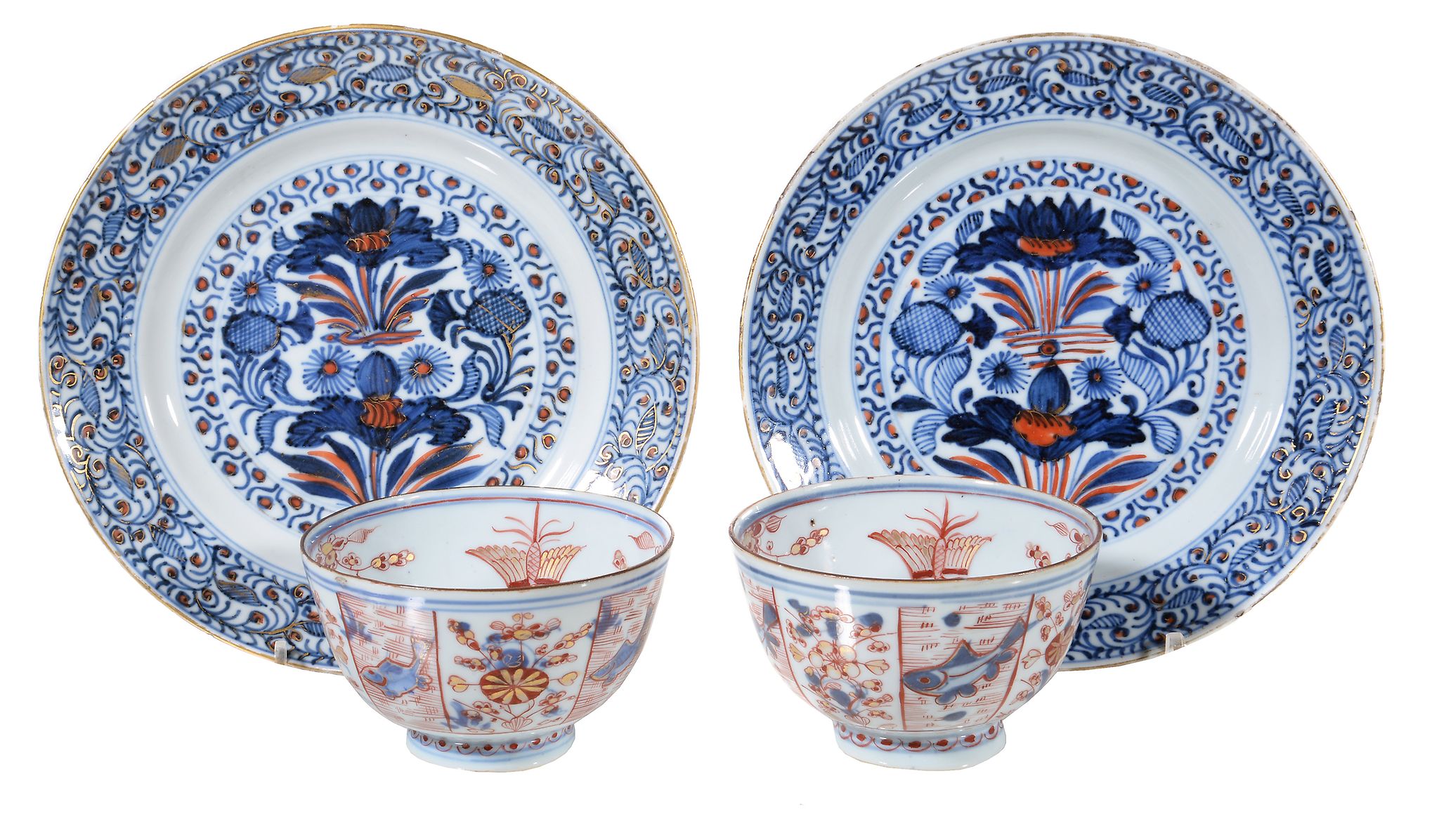 A pair of Chinese Imari plates, Kangxi, painted with lotus flowers, within stylised floral