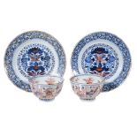 A pair of Chinese Imari plates, Kangxi, painted with lotus flowers, within stylised floral
