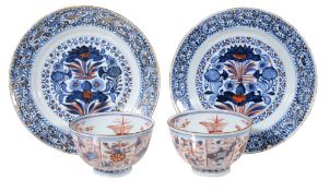 A pair of Chinese Imari plates, Kangxi, painted with lotus flowers, within stylised floral