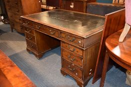 A stained hardwood and leatherette inset twin pedestal partner's desk in George III style, early