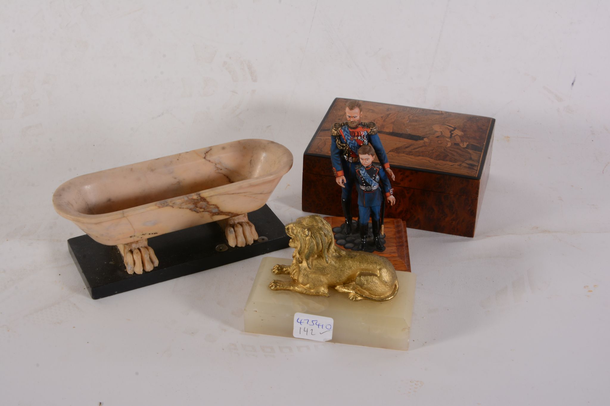 An Italian Grand Tour marmo giallo model of a sarcophagus, late 19th century, on a rectangular black