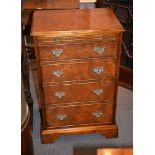 A modern walnut hi-fi cabinet, in the form of a George III dressing chest of drawers, 91cm high,