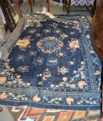 A Chinese rug, approximately 250cm x 177cm
