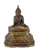 A Burmese or Thai figure of The Buddha, 17th century, the figure sits in bhumisparsha mudra atop a