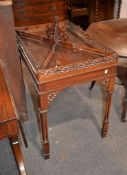 A mahogany silver table in George III style, with pierced gallery above cluster column legs with