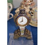 A French porcelain Sevres style and gilt metal mounted mantel timepiece, 22cm high