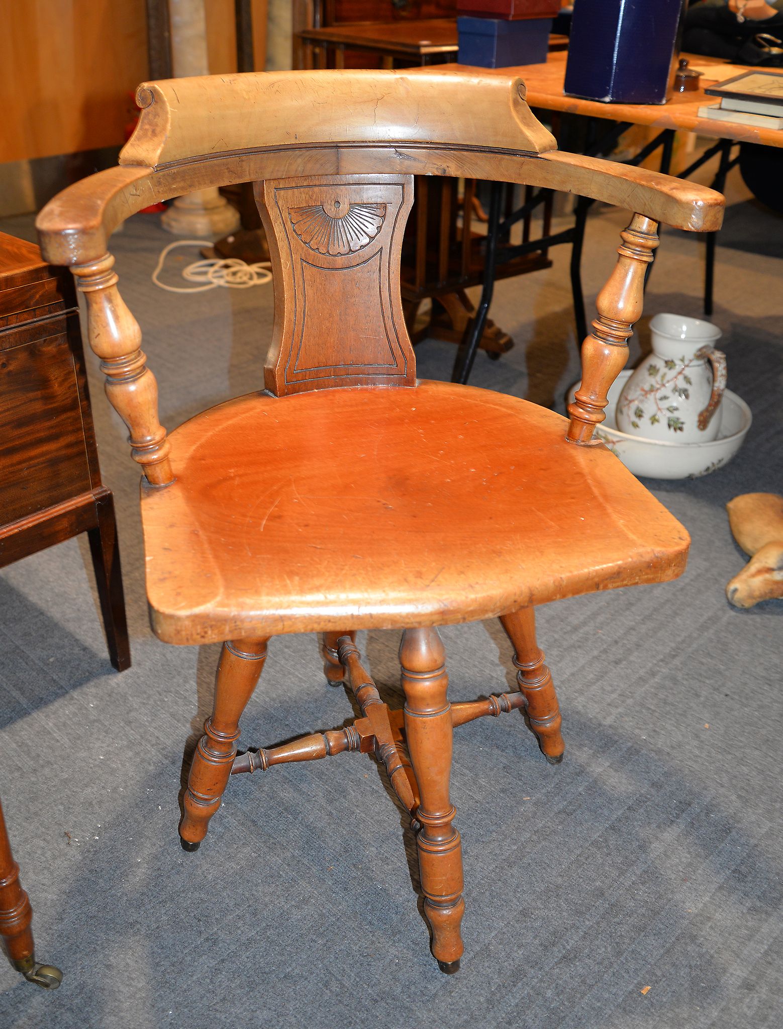 A walnut revolving desk chair