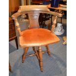 A walnut revolving desk chair