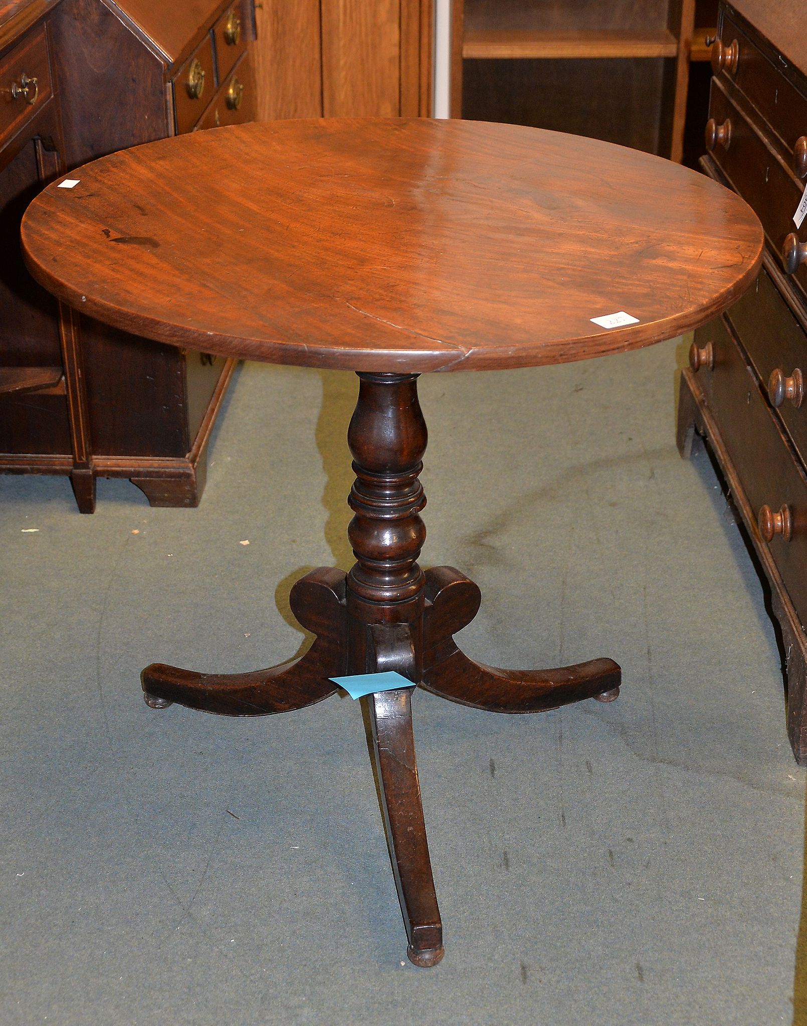 A Regency mahogany occasional table on hipped outswept supports Provenance: Removed from an