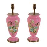 A pair of gilt metal mounted porcelain urns fitted as table lamps, 20th century, the inverted