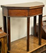 A George III mahogany fold-over tea table on canted design, 74cm high, 83cm wide, 40.5cm deep closed
