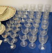 A Baccarat glass part table service, comprising 24 wine glasses and 13 smaller goblets, acid