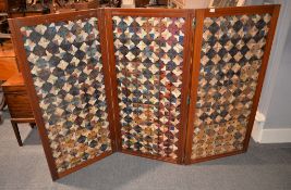 A late Victorian walnut three-fold screen, each panel with woven geometric designs, 123cm high
