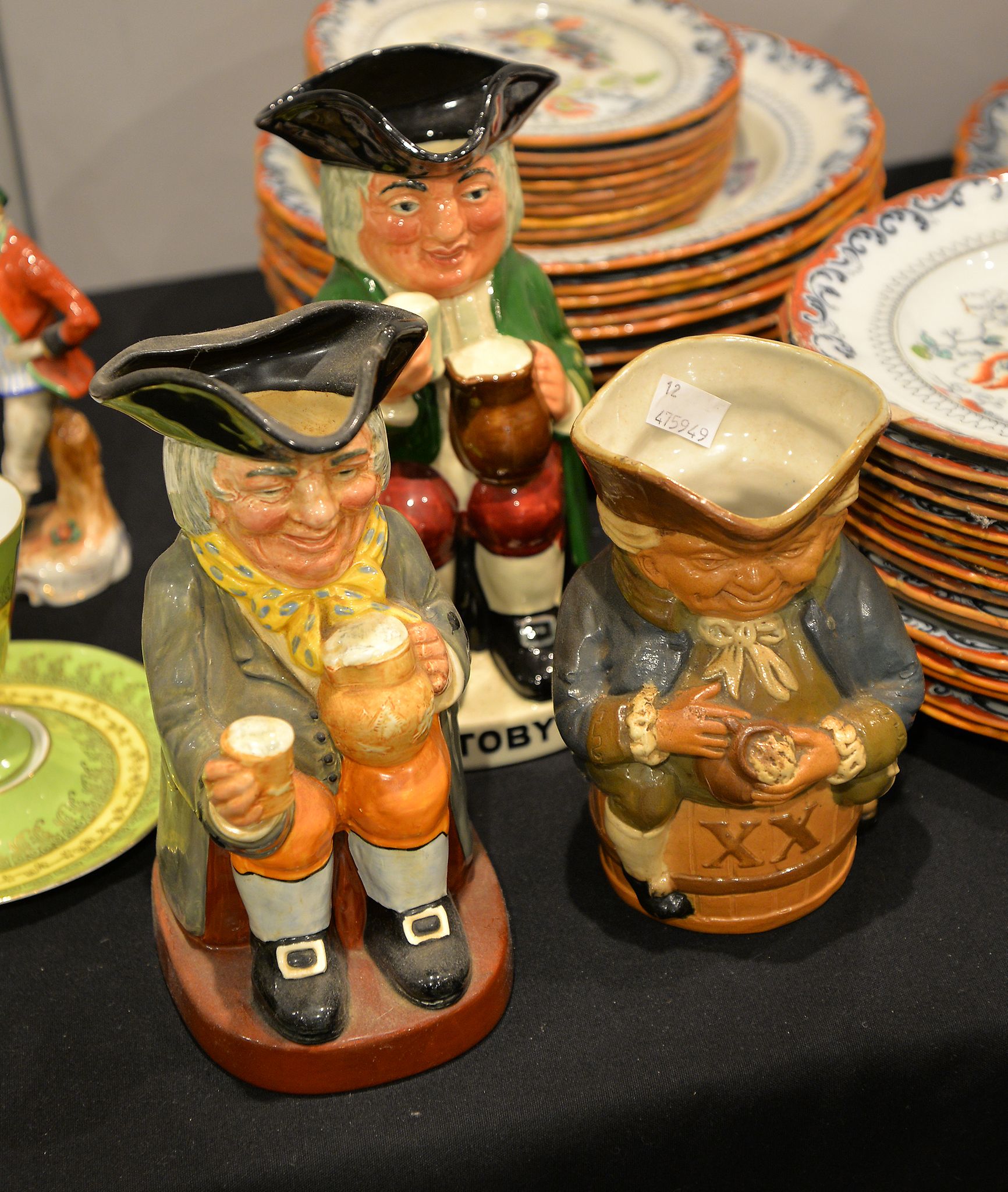 A Royal Doulton Toby Jug, another Royal Doulton character jug of Happy John, and a Royal Doulton