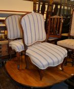 A pair of Continental walnut side chairs, mid-18th century, each 96cm high, 58cm wide, 50cm deep