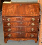 A mahogany bureau in George III style, the fall enclosing an arrangement of drawers and pigeon