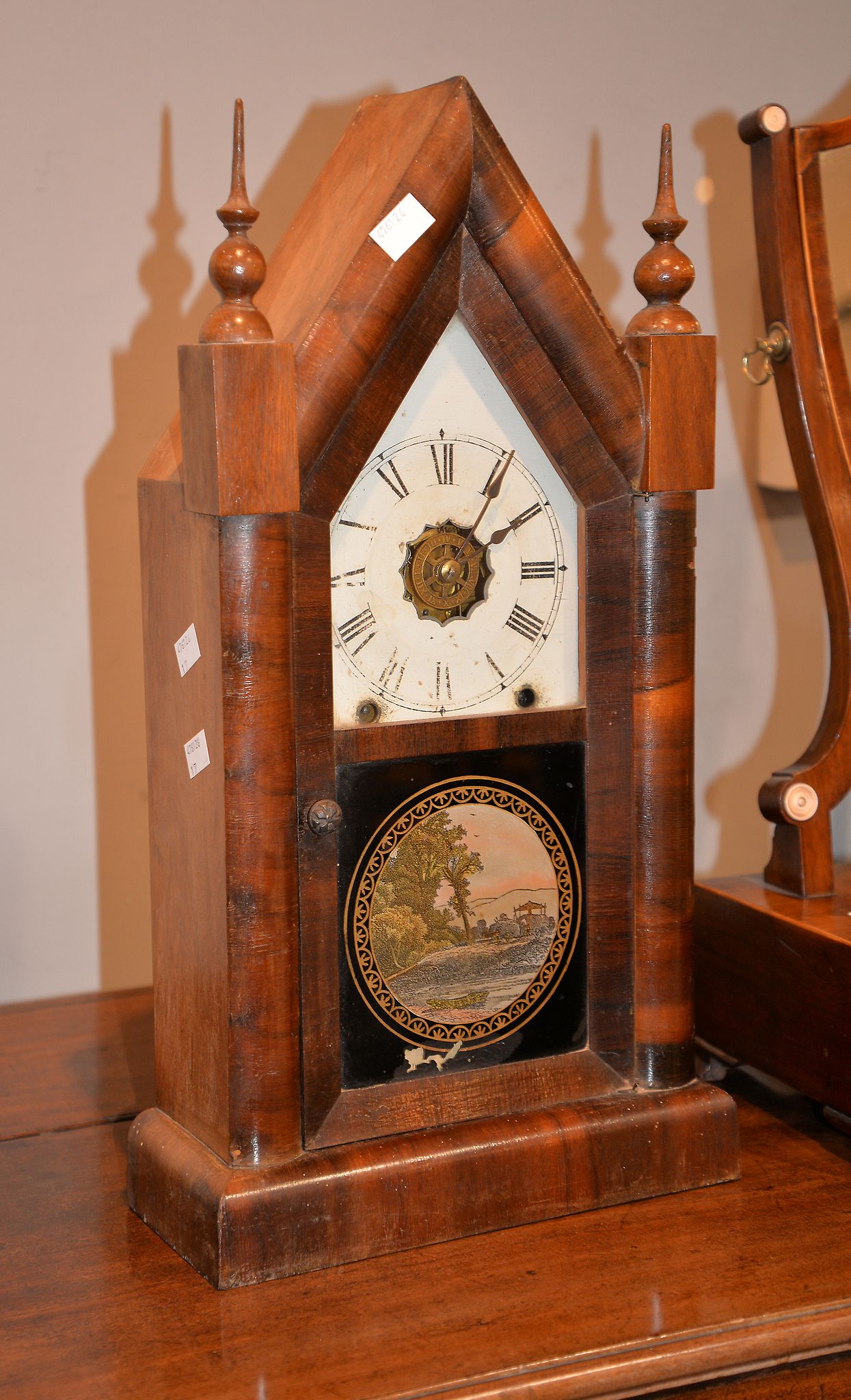 An American walnut shelf clock, with two train movement, the lancet case with glazed door and