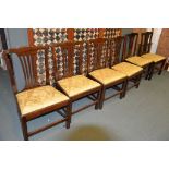 A set of six mahogany dining chairs in George III style each with drop in seats Provenance: