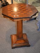 Ω An octagonal pedestal rosewood veneered games table, 77cm high, the top 61cm x 60cm Cites