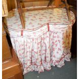 A kidney shaped dressing table covered in floral fabric, 77cm high, 93cm wide