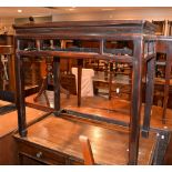 A Chinese stained padouk wood rectangular side table, with pierced side rails, square legs and spade