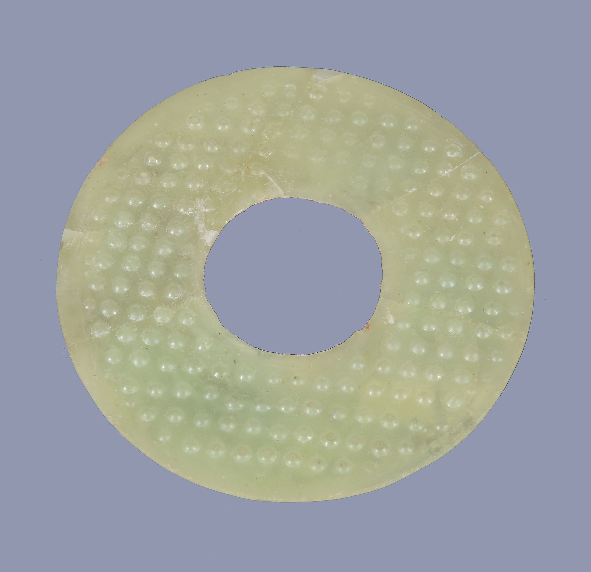 A Chinese glass disc , bi , of celadon colour imitating jade, possibly Warring States-Han Dynasty,