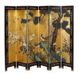 A Chinese polychrome lacquer and parcel gilt six fold screen, 20th century, decorated with a scene