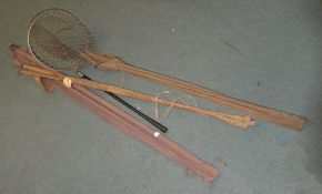 A quantity of various vintage fishing equipment including a split cane fishing rod, a landing net,