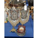 A pair of Early Victorian table screens, a silver plate coaster and a miniature of Napoleon