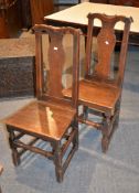 A pair of oak back stools with vase shaped splats in early 18th century style, 19th century, solid