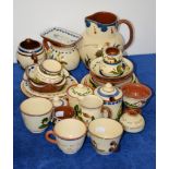 A quantity of Devon pottery mottoware, including Watcombe, and Longpark Torquay examples Provenance: