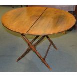 A stained wood coaching table with ivorine plaque for THORNTON & HERNE, 99cm diameter, and three