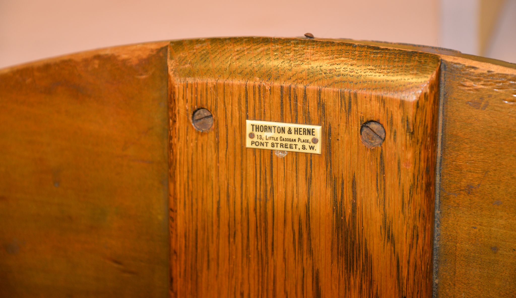 A stained wood coaching table with ivorine plaque for THORNTON & HERNE, 99cm diameter, and three - Image 2 of 3