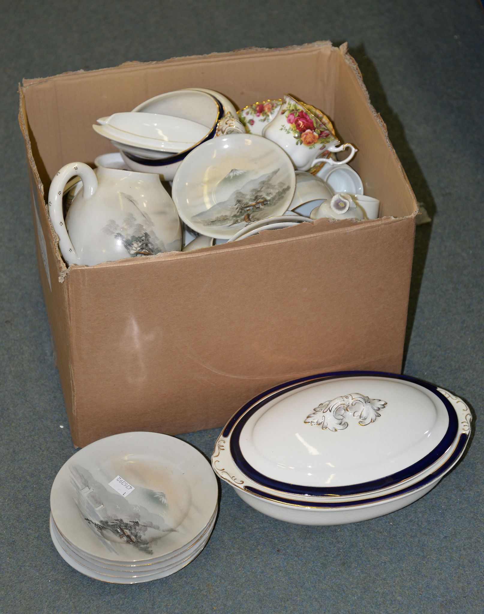 A box containing various part teasets, including Royal Albert 'Old Country Roses', Wedgwood -