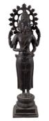A Indian bronzed metal model of Vishnu, 19th or early 20th century, standing on a lotus base over