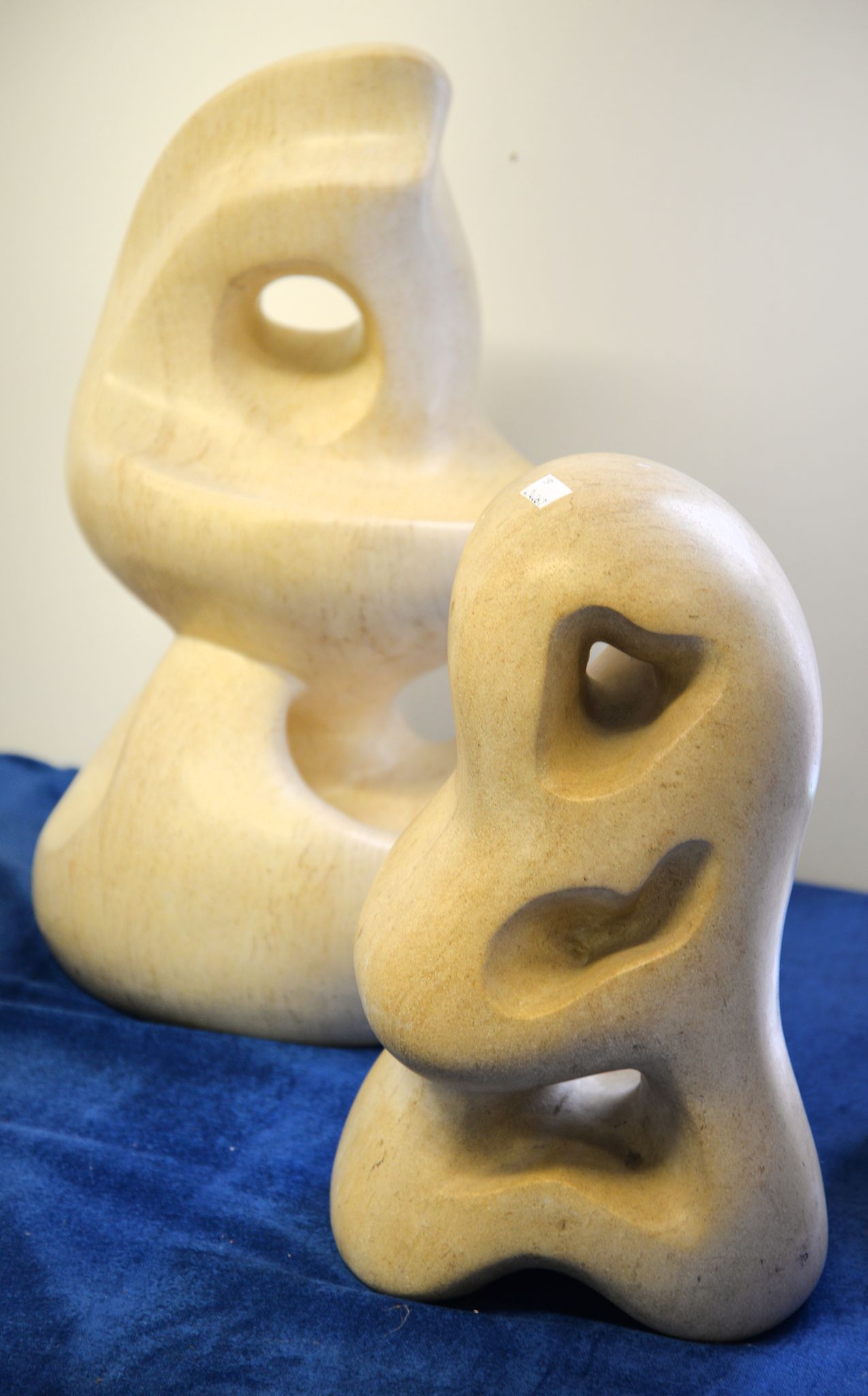Beatrice Murray (contemporary), two carved stone abstract sculptures, the larger signed BEA and