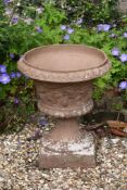 A campana shaped garden urn and base, 58cm high