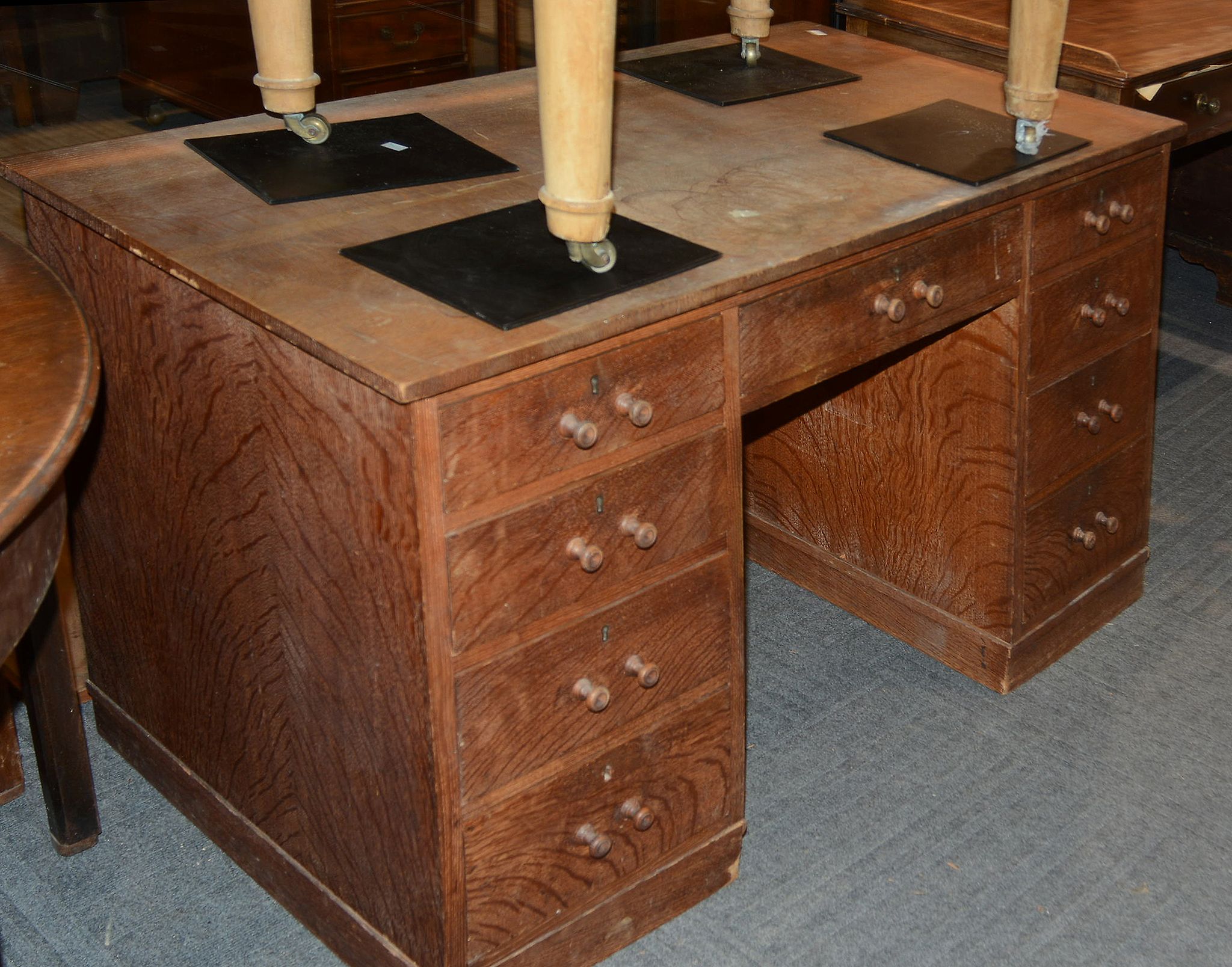 An oak pedestal desk , circa 1920, 70cm high, 66cm deep, 135cm wide